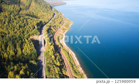 Beautiful landscape from the air. Road and railway along the lake Beautiful landscape from the air. Road and railway along the lake 125980059