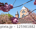 Tower with Japanese cherry tree in the foreground 125981882