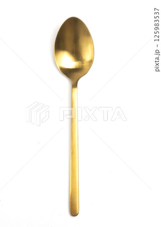 golden spoon isolated on white background golden spoon isolated on white background 125983537