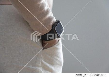 business, technology, communication and people concept - close up of woman hands with smart watch screen at office business, technology, communication and people concept - close up of woman hands with smart watch screen at office 125984802