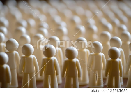 Many tiny figures arranged in rows on a surface create a unique visual effect during a gathering 125985682