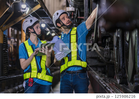 Engineer checking construction process railway and checking work on railroad station 125986216