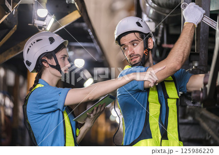 Engineer checking construction process railway and checking work on railroad station Engineer checking construction process railway and checking work on railroad station 125986220