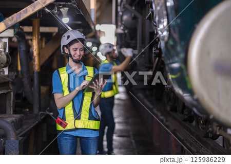 Engineer checking construction process railway and checking work on railroad station 125986229