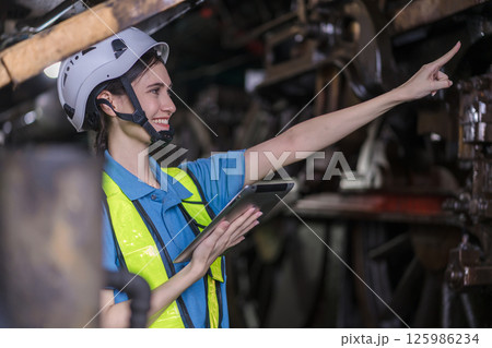Engineer checking construction process railway and checking work on railroad station Engineer checking construction process railway and checking work on railroad station 125986234