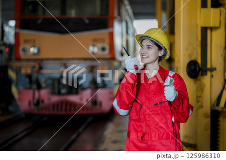 Engineer checking construction process railway and checking work on railroad station Engineer checking construction process railway and checking work on railroad station 125986310