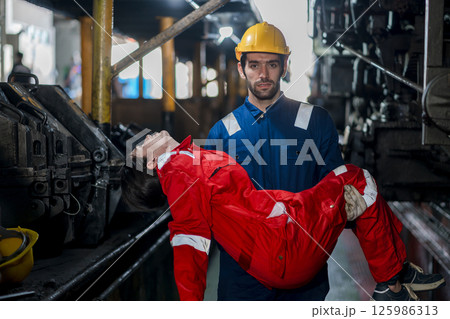 First aid support accident at work of worker at factory.  125986313