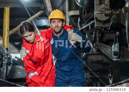 First aid support accident at work of worker at factory.  125986319