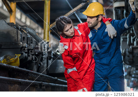 First aid support accident at work of worker at factory.  125986321