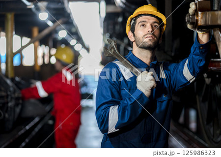 Engineer checking construction process railway and checking work on railroad station Engineer checking construction process railway and checking work on railroad station 125986323