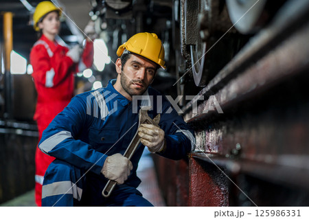 Engineer checking construction process railway and checking work on railroad station 125986331