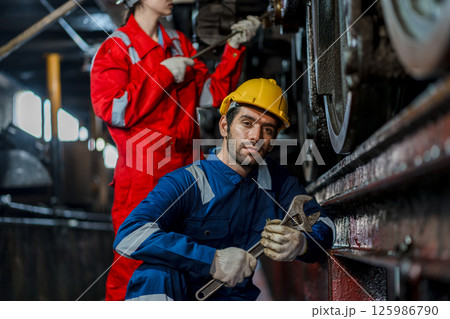 Engineer checking construction process railway and checking work on railroad station Engineer checking construction process railway and checking work on railroad station 125986790