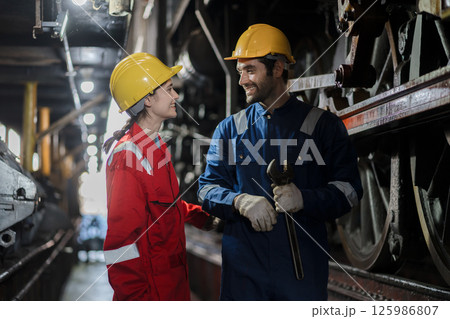 Engineer checking construction process railway and checking work on railroad station 125986807