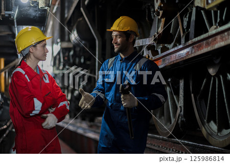 Engineer checking construction process railway and checking work on railroad station Engineer checking construction process railway and checking work on railroad station 125986814