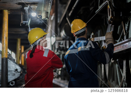 Engineer checking construction process railway and checking work on railroad station Engineer checking construction process railway and checking work on railroad station 125986818