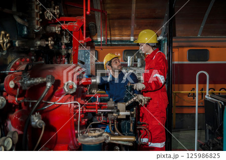 Engineer checking construction process railway and checking work on railroad station 125986825