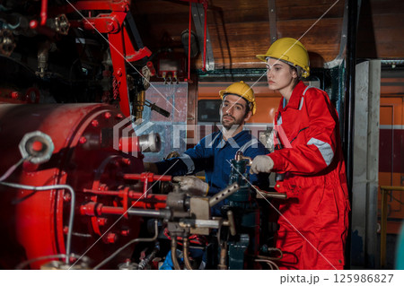 Engineer checking construction process railway and checking work on railroad station Engineer checking construction process railway and checking work on railroad station 125986827