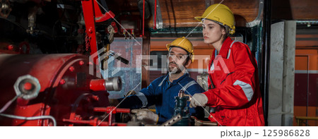 Engineer checking construction process railway and checking work on railroad station Engineer checking construction process railway and checking work on railroad station 125986828