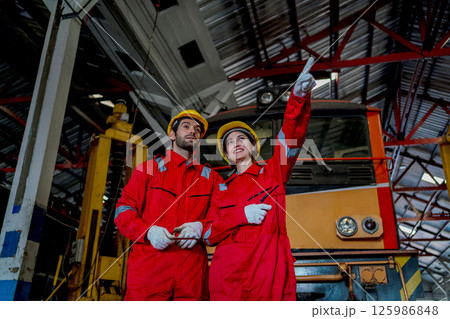 Engineer checking construction process railway and checking work on railroad station 125986848