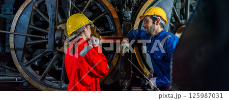 Engineer checking construction process railway and checking work on railroad station  125987031