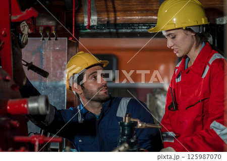 Engineer checking construction process railway and checking work on railroad station Engineer checking construction process railway and checking work on railroad station 125987070