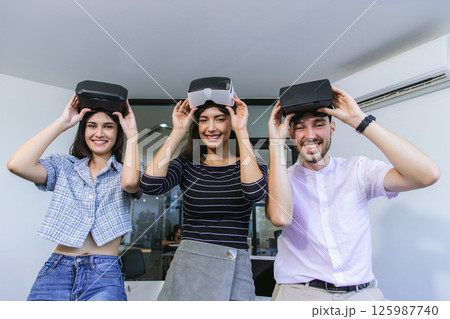 business persons with virtual reality headsets in meeting room at the office. 125987740