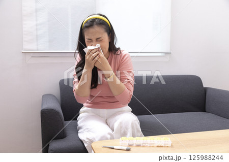 Sick Woman with Thermometer.Flu.Woman Caught Cold. Sneezing into Tissue. Headache.Virus. 125988244