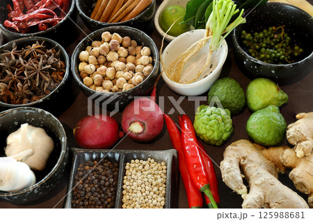 Top view shot Spices and herbs. Thai and Chinese herbs in bowl . Colorful Thai spices in small bowls 125988681