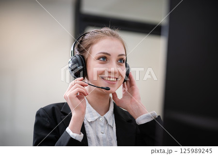 Call center staff are providing business conversation services in the office. Call center staff are providing business conversation services in the office. 125989245