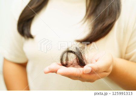 Woman with beautiful shine hair care treatment. Woman with beautiful shine hair care treatment. 125991313