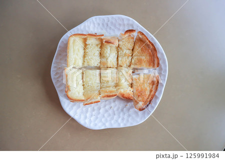 toast or bread with butter topping , toast bread or sliced bread toast or bread with butter topping , toast bread or sliced bread 125991984