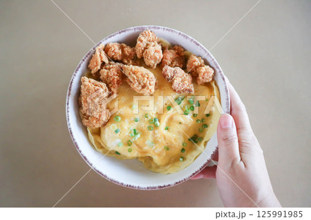 creamy omelet or omelet or omelette or fried egg with fried chicken or crispy chicken or chicken 125991985