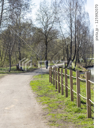 People enjoying first warm days outdoors 125992070