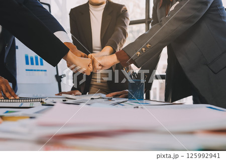 Business handshake for teamwork of business merger and acquisition,successful negotiate,hand shake,two businessman shake hand with partner to celebration partnership and business deal concept 125992941