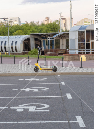 Shot of the rental electric scooter on the street of the city 125993927
