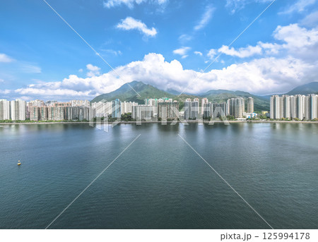 Waterfront Cityscape with High Rise Buildings and a Mountainous Backdrop May 4 2025 Waterfront Cityscape with High Rise Buildings and a Mountainous Backdrop May 4 2025 125994178