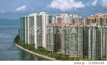 Waterfront Cityscape with High Rise Buildings and a Mountainous Backdrop May 4 2025 125994184