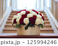 Close-up of a beautiful bouquet featuring red and white roses in a stylish round box. Perfect for Valentines Day, Mothers Day, Birthday, weddings, business for florists, blog post, advertisements 125994246
