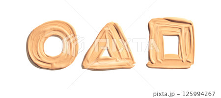 Beige makeup foundation smudged in circle triangle and square shapes on white Beige makeup foundation smudged in circle triangle and square shapes on white 125994267