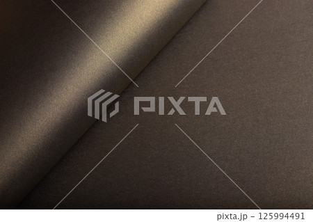 Brown paper texture with antique gold and dark gold tones, glossy glistering surface with shimmering 125994491