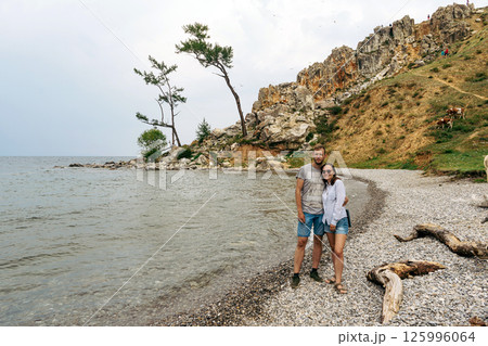Couple on the shore of Lake Baikal, Olkhon Island Couple on the shore of Lake Baikal, Olkhon Island 125996064