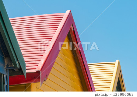 colorfu roofs of l beach houses, bathing boxes, change cubicles, at Muizenberg colorfu roofs of l beach houses, bathing boxes, change cubicles, at Muizenberg 125996065