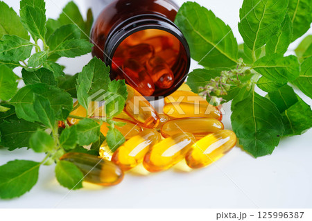 Alternative medicine herbal organic capsule with vitamin E omega 3 fish oil, mineral, drug with herbs leaf natural supplements for healthy good life. 125996387