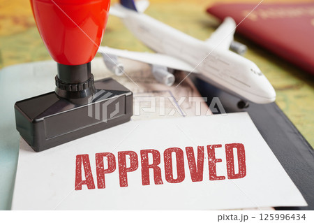 Approved Stamp passport document to immigration at airport. 125996434