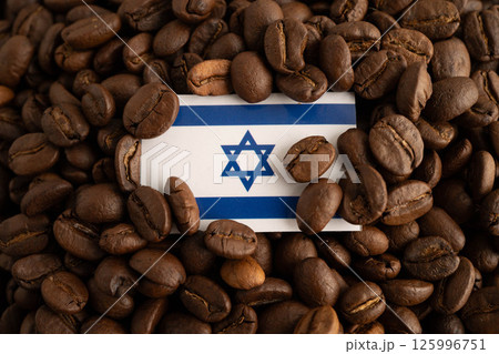 Israel flag on coffee beans, shopping online for export or import food product. Israel flag on coffee beans, shopping online for export or import food product. 125996751