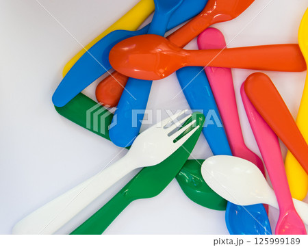 Colorful plastic little spoons on the white background. 125999189