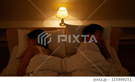 Couple Sleeping Back to Back, No Physical Contact, Cold Mood Couple Sleeping Back to Back, No Physical Contact, Cold Mood 125999251