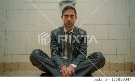 Man Sitting in Shower Fully Clothed, Emotional Burnout Depicted Man Sitting in Shower Fully Clothed, Emotional Burnout Depicted 125999344