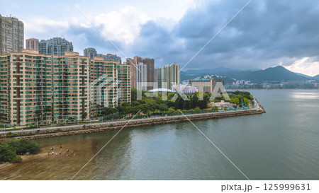 Coastal View of Island with Urban and Mountain Backdrops May 4 2025 125999631