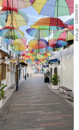 Colorful umbrellas adorn Armenian Street in George Town, Penang on a bright morning in March 2025 126000030